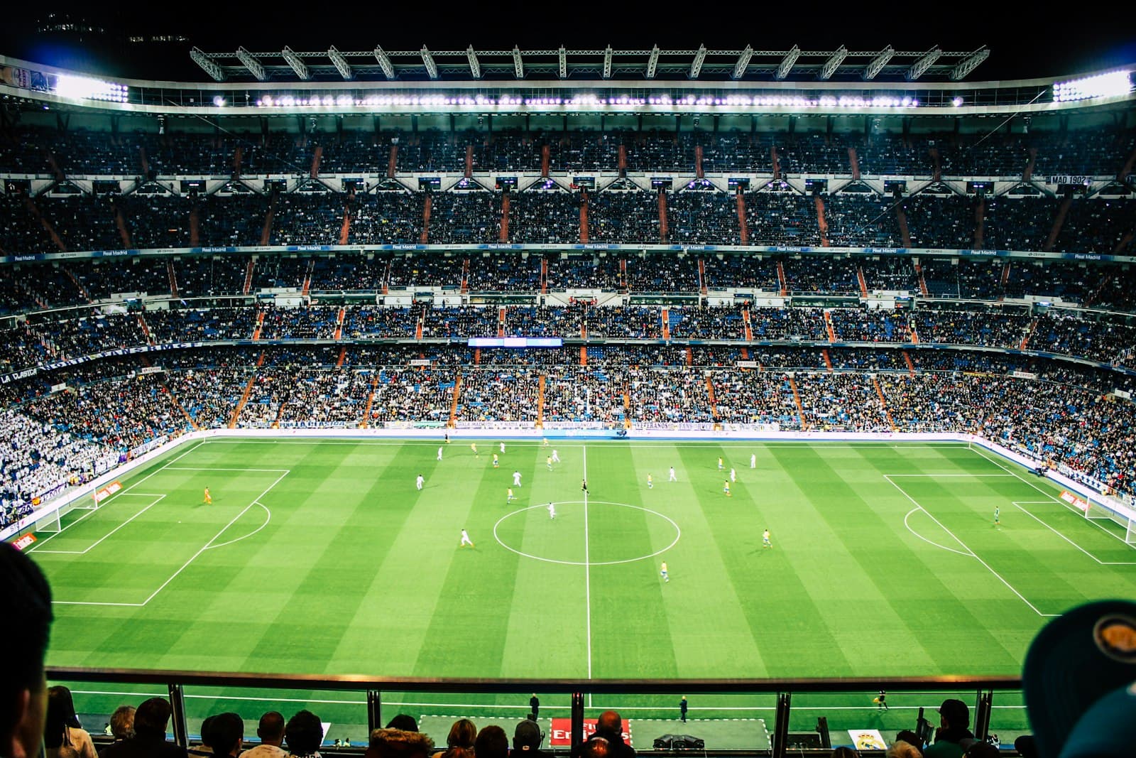 A packed soccer stadium overlooking the pitch